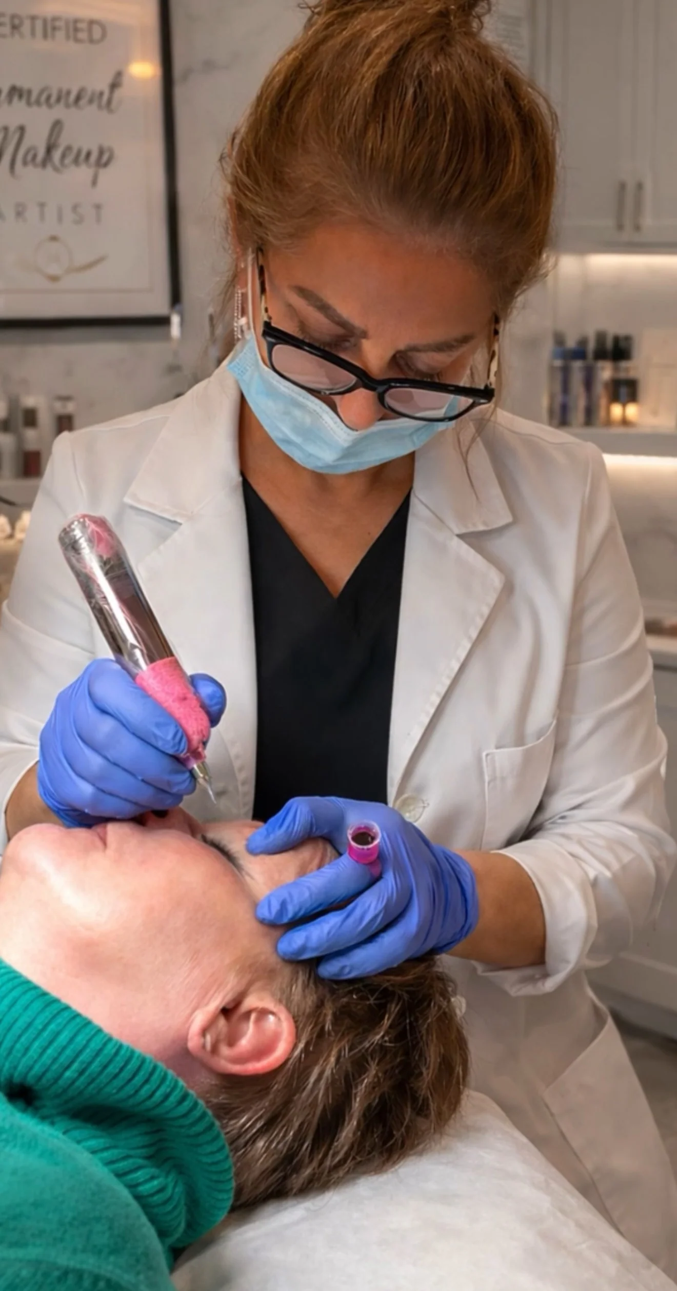 Nahid Farzinzad performing a permanent makeup treatment