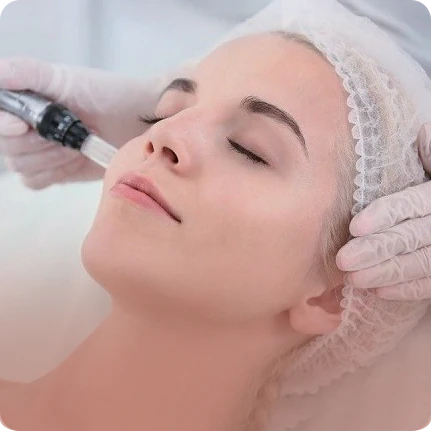 Woman receiving a facial injection treatment with a professional in a clinical setting.