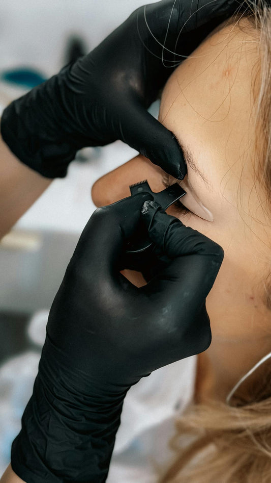 Hairstroke brow microblading tattoo procedure closeup