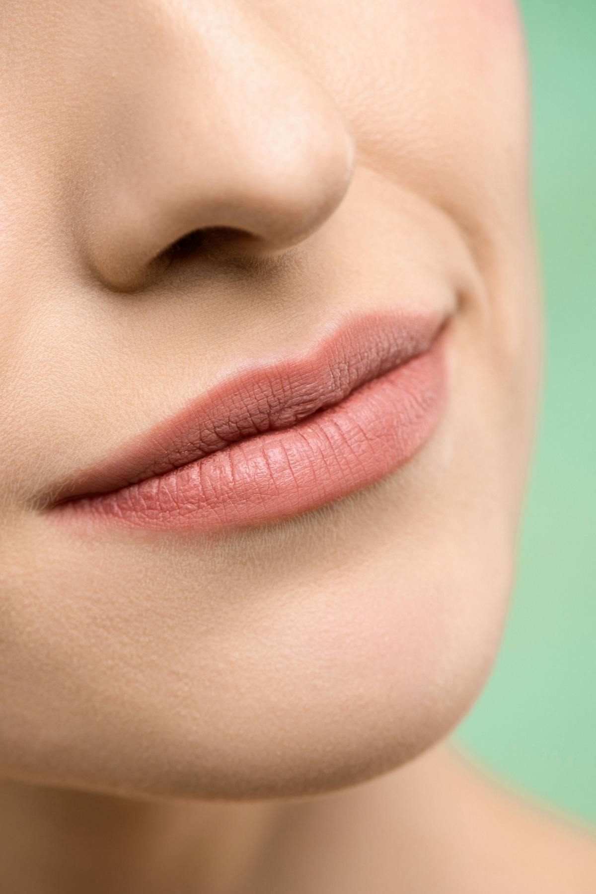 Close up of woman lips permanent lip tattoo