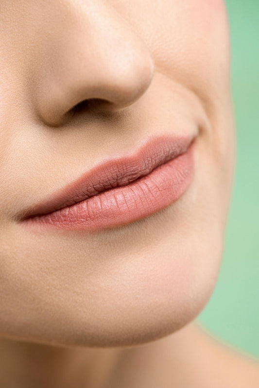 Close up of woman lips permanent lip tattoo