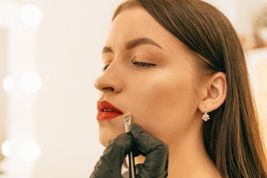 Woman wearing red lipstick lip liner tattoo